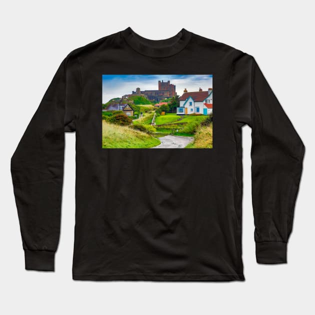 View of Bamburgh village and castle, Northumberland, UK Long Sleeve T-Shirt by Itsgrimupnorth